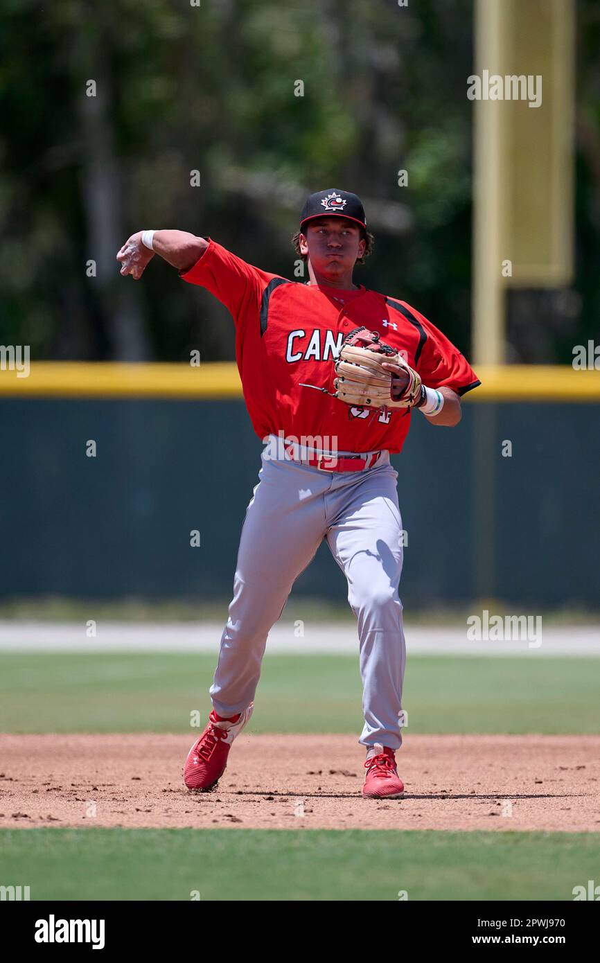 Team Canada 18u third baseman Myles Naylor (34) throws to first base during  an extended spring training baseball game against the Tampa Bay Rays on  April 22, 2023 at Buck O'Neil Complex
