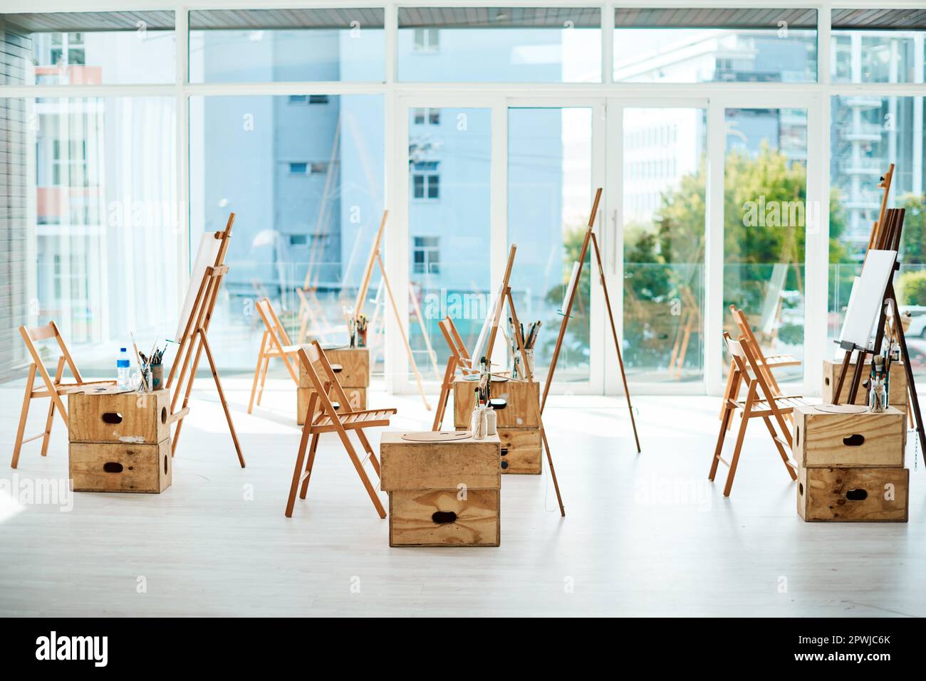 Start each day with a blank canvas. a group of easels and canvases