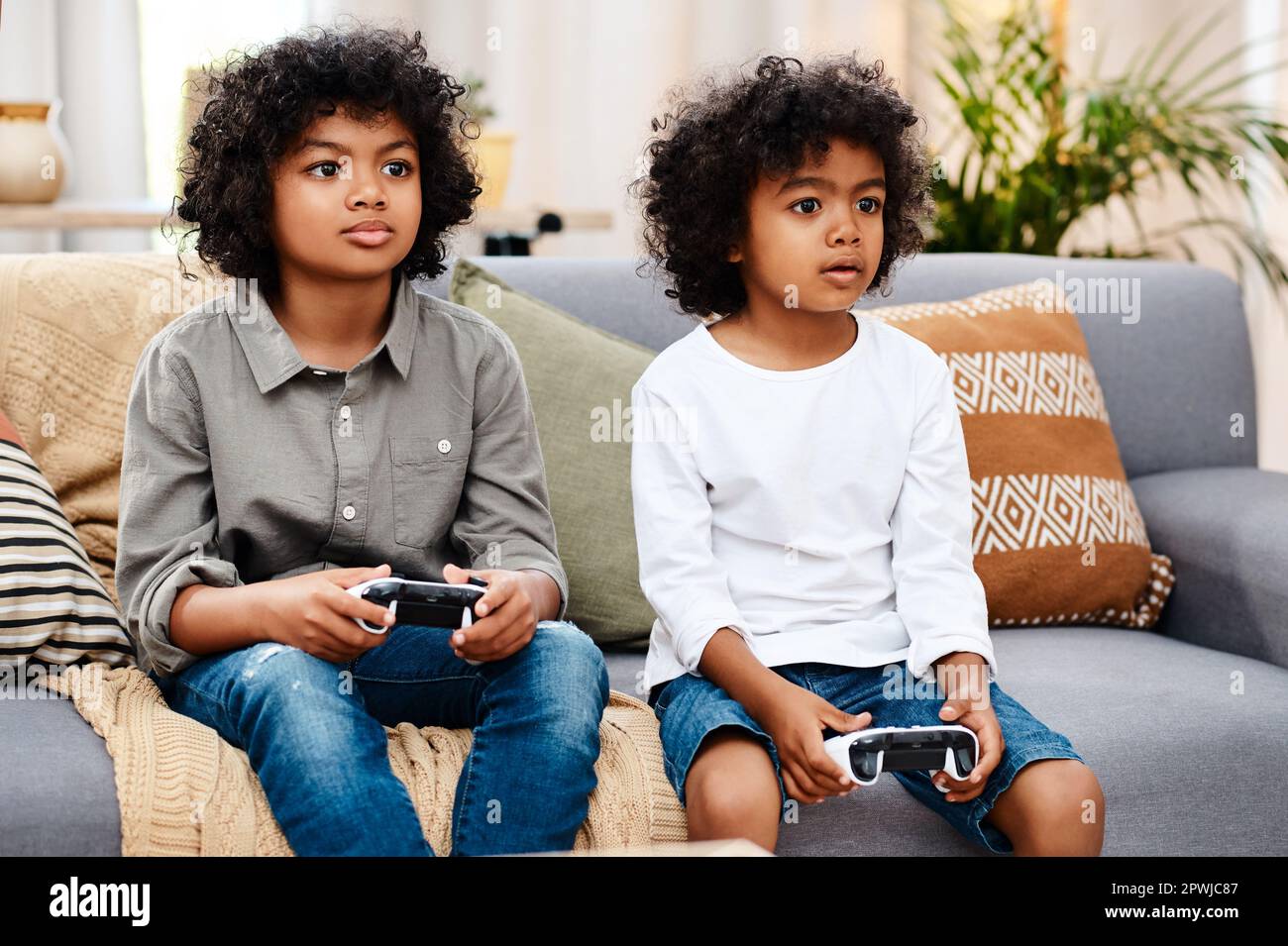 Smiling African Boy Playing Online Games in Class Stock Photo - Image of  phone, modern: 177228872