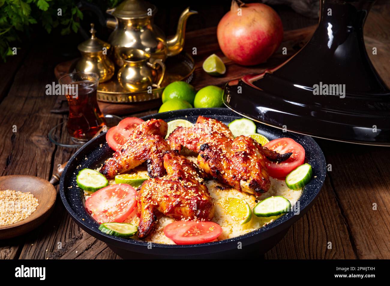 couscous with fried chicken wings spicy Stock Photo Alamy