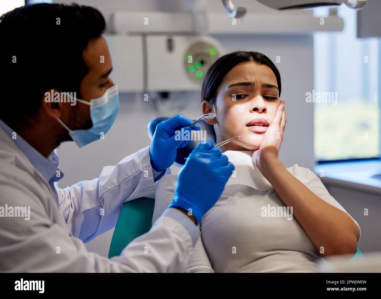 Lets make your tooth pain a thing of the past. a young woman