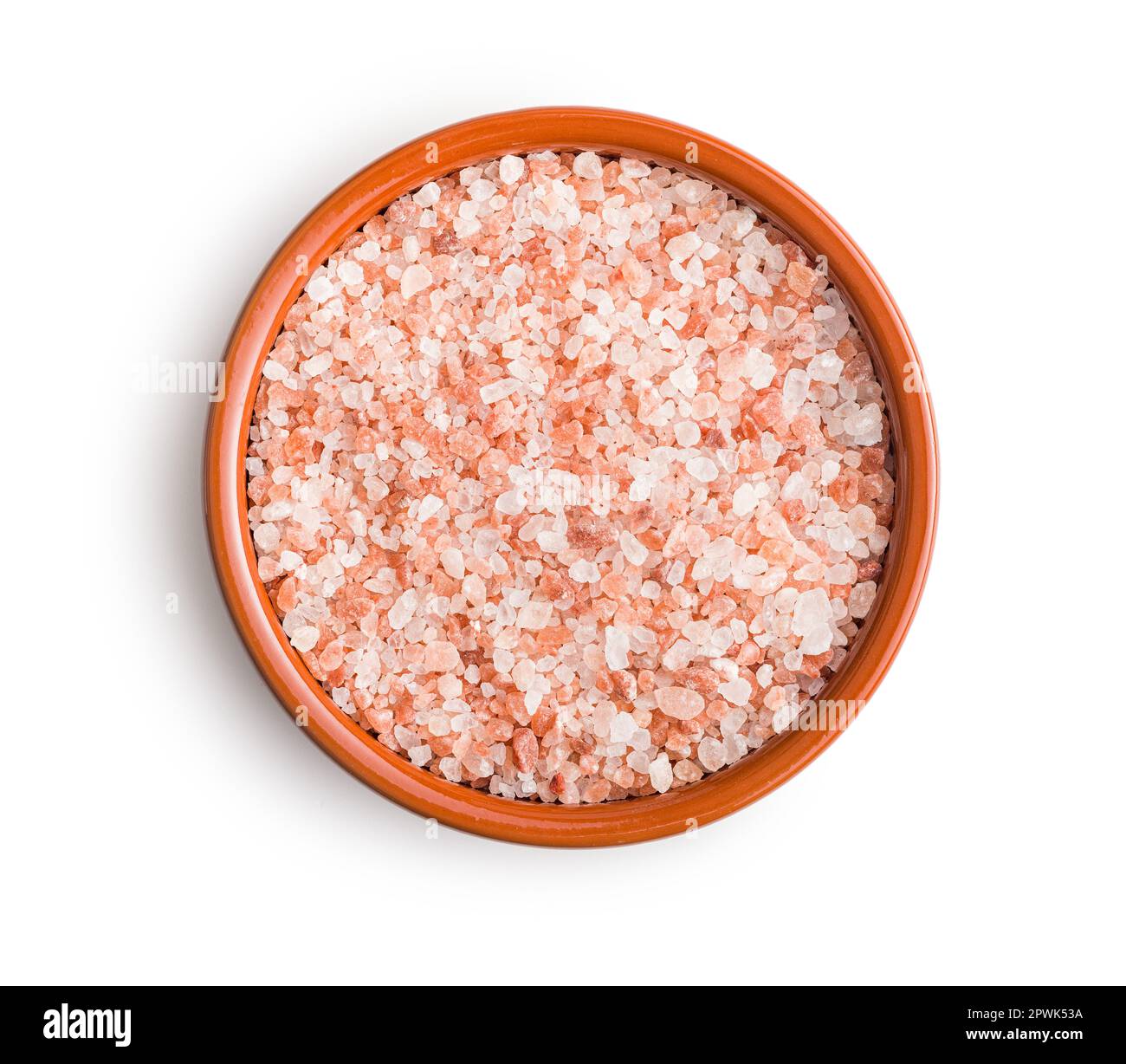 Pink himalayan salt in bowl isolated on the white background. Stock Photo