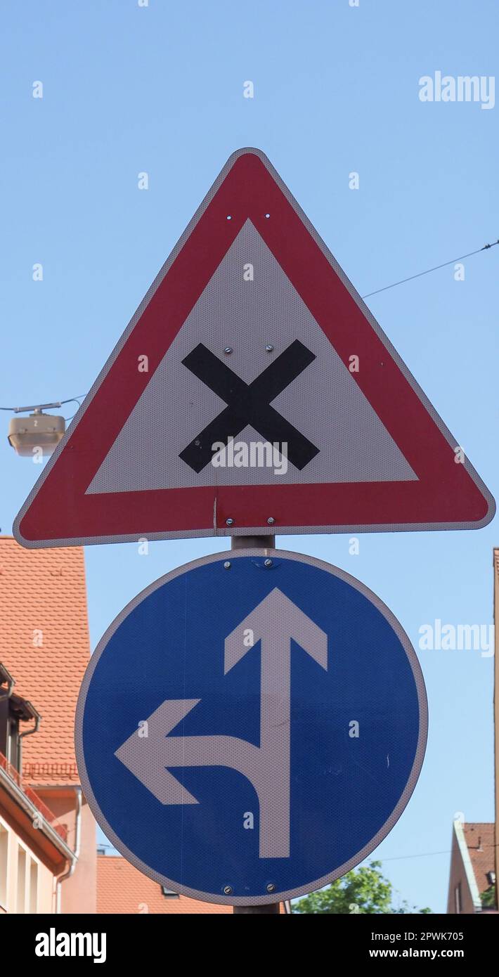 Crossroad sign and forward and left direction sign Stock Photo - Alamy