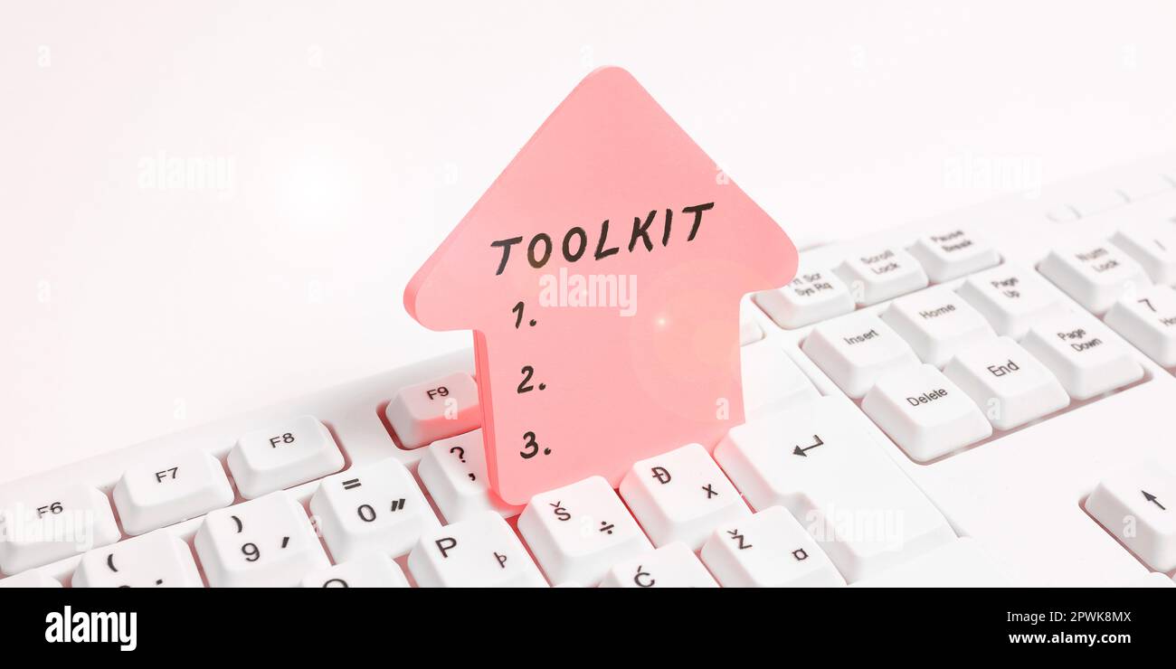 Hand writing sign Toolkit, Business overview set of tools kept in a bag ...