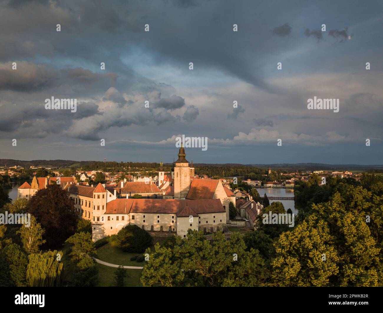 Aerial view just after sunrise of the pond and bridge in front of the ...