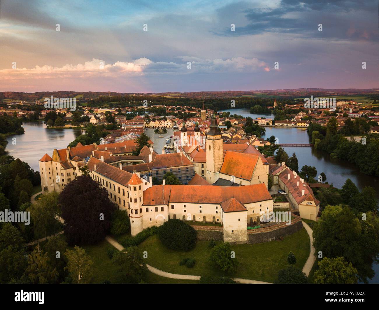 Aerial view just after sunrise of the pond and bridge in front of the ...