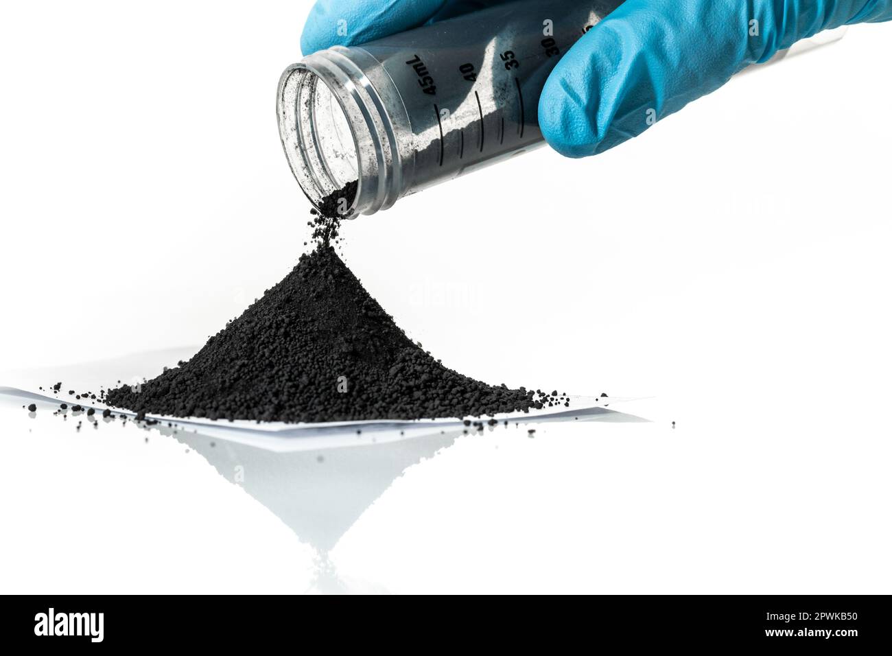 Iron nanoparticles in a lab, on a white glossy surface Stock Photo