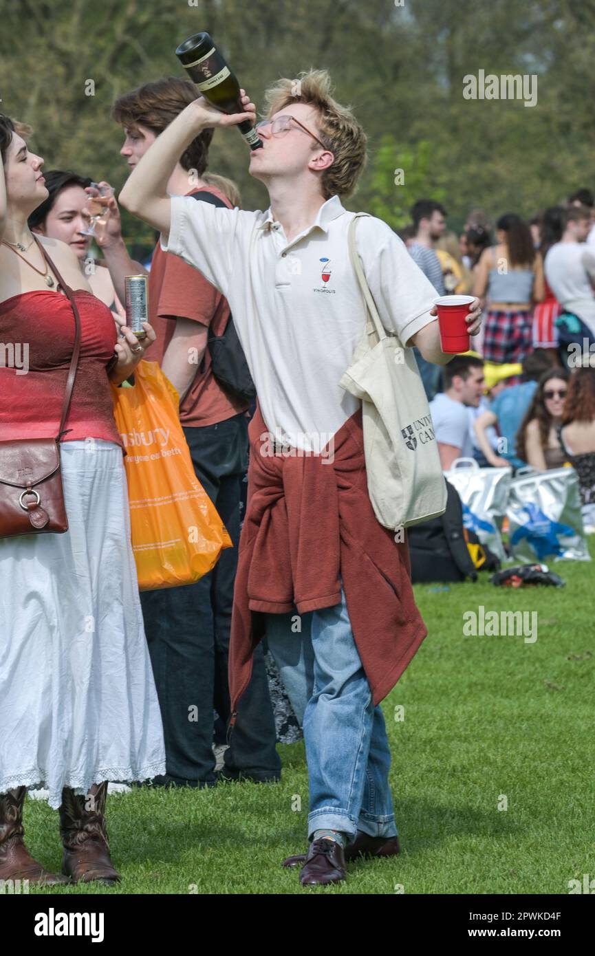 Jesus Green, Cambridge, 30th April 2023 - Hordes of Cambridge University students flocked to a park on Sunday afternoon in the Bank Holiday sunshine for the annual 'Caesarian Sunday' drinking party. Undergraduates from the prestigious institutions frolicked through the afternoon in fancy dress taking part in drinking games on Jesus Green. The tradition, also known as ‘C-Sunday' attracts thousands of students just before they take part in exams. Police were present to keep the academics in check. With some revellers needing assistance from paramedics after various mishaps. Credit: Ben Formby / Stock Photo