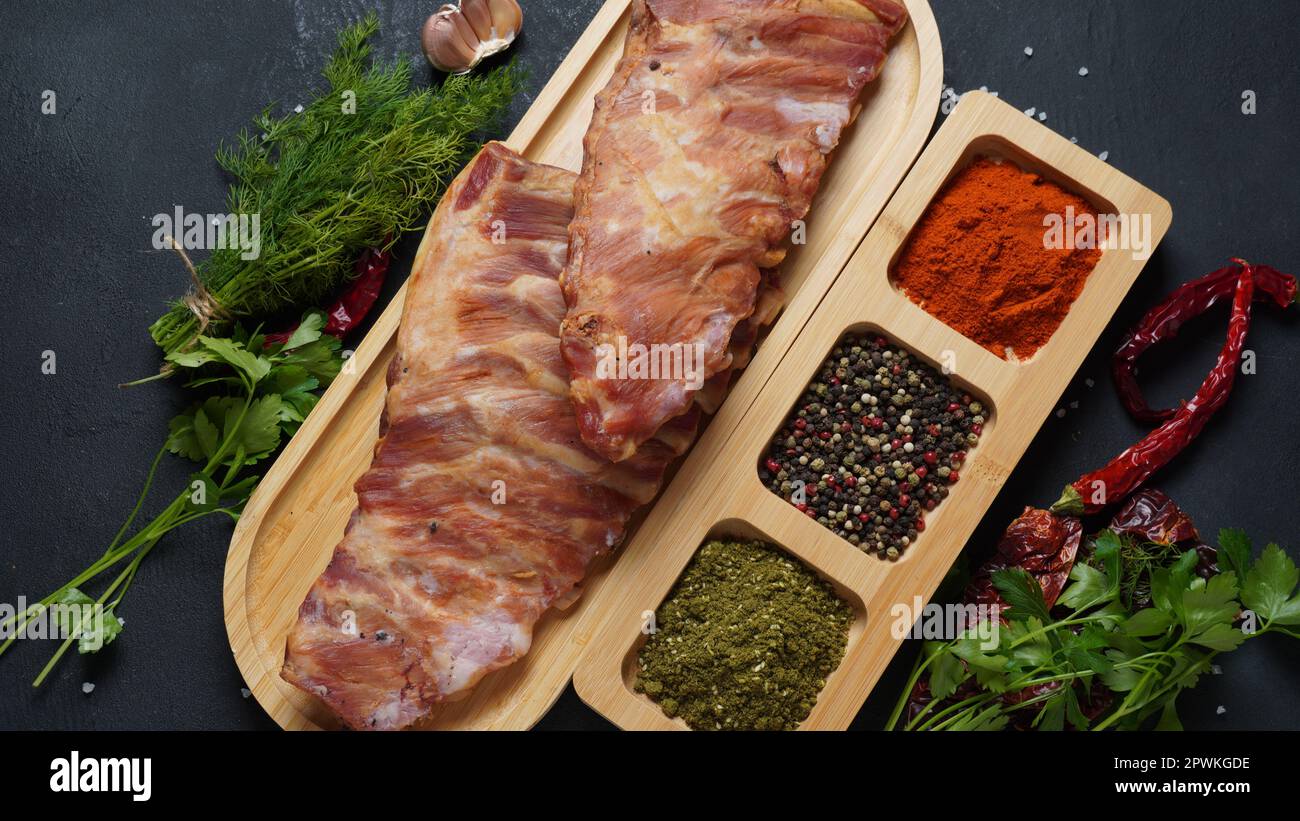 Two racks of smoked pork ribs with spices and herbs Stock Photo - Alamy