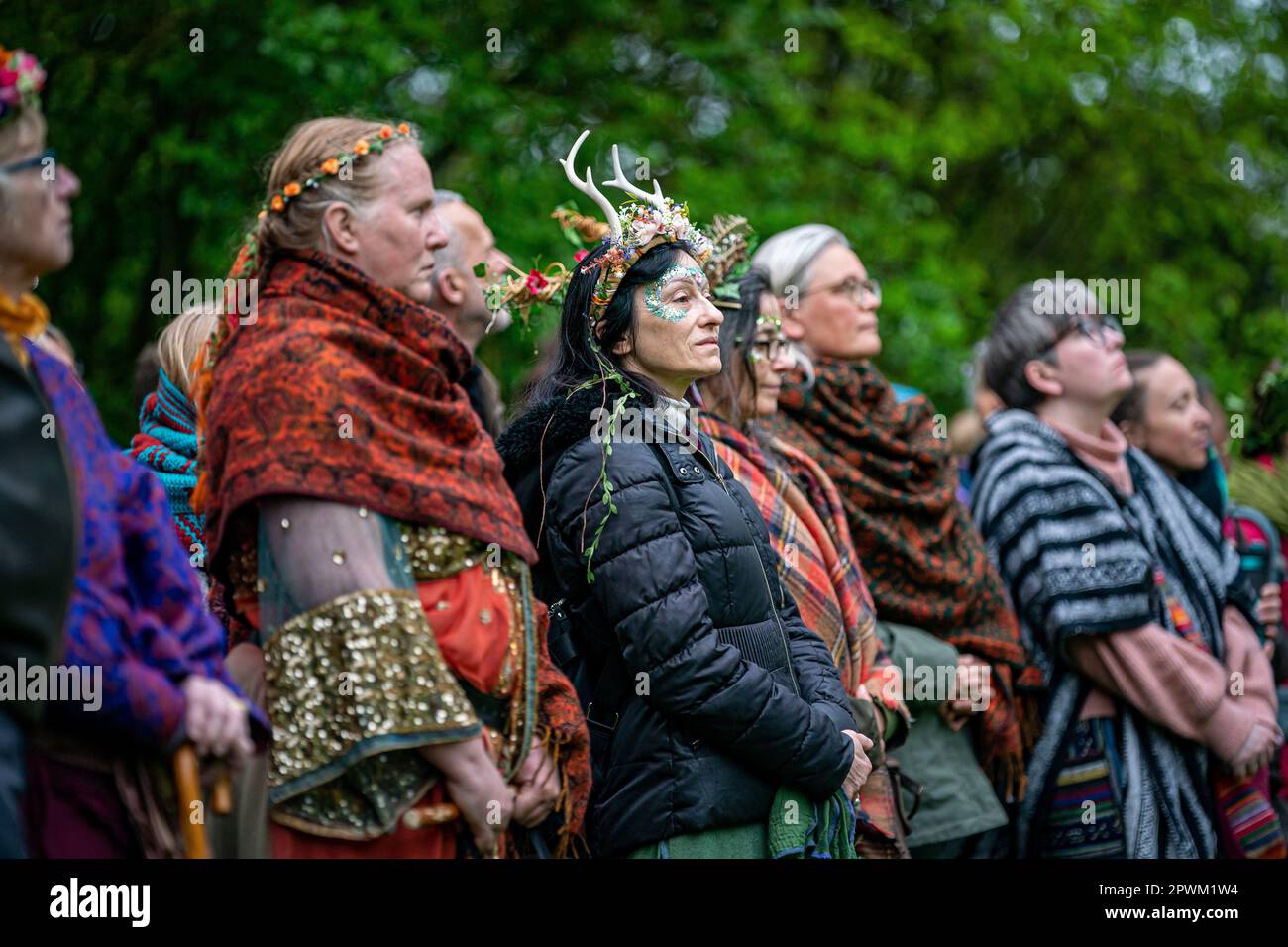 People watch the Beltane ceremony at Chalice Well, Glastonbury