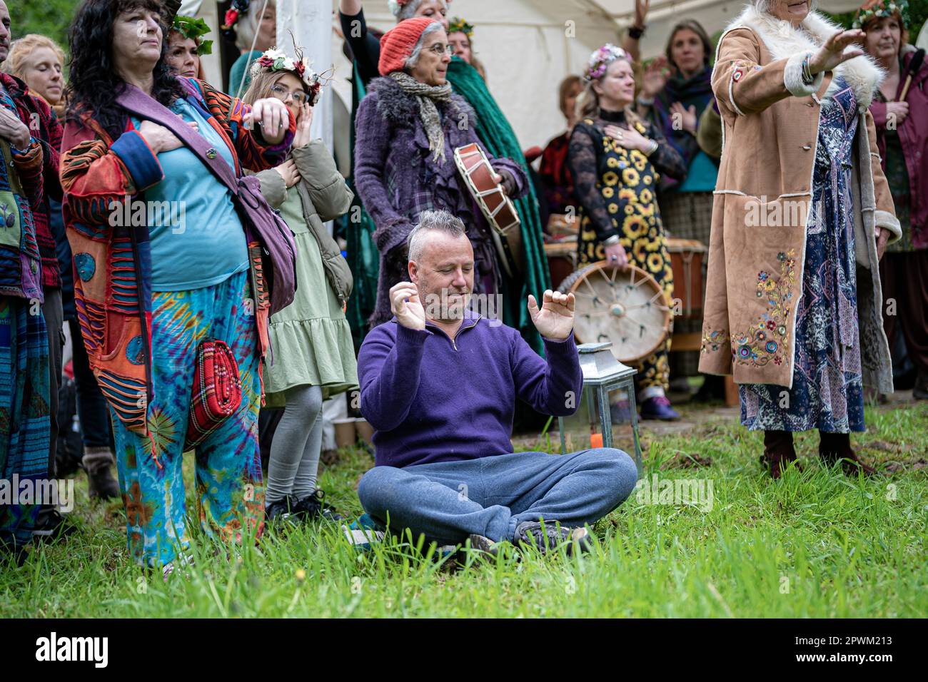 People watch the Beltane ceremony at Chalice Well, Glastonbury