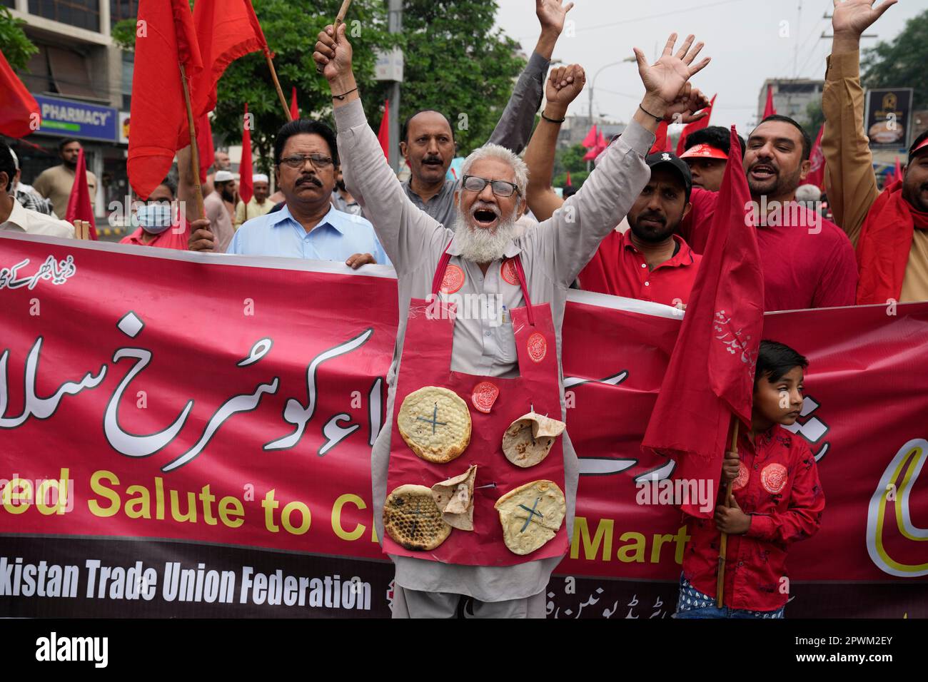 Activists of Pakistan's trade Union Federation shout slogans during a May  Day rally to mark International Labour Day in Lahore, Pakistan, Monday, May  1, 2023. Participants of the rally demand implementation of