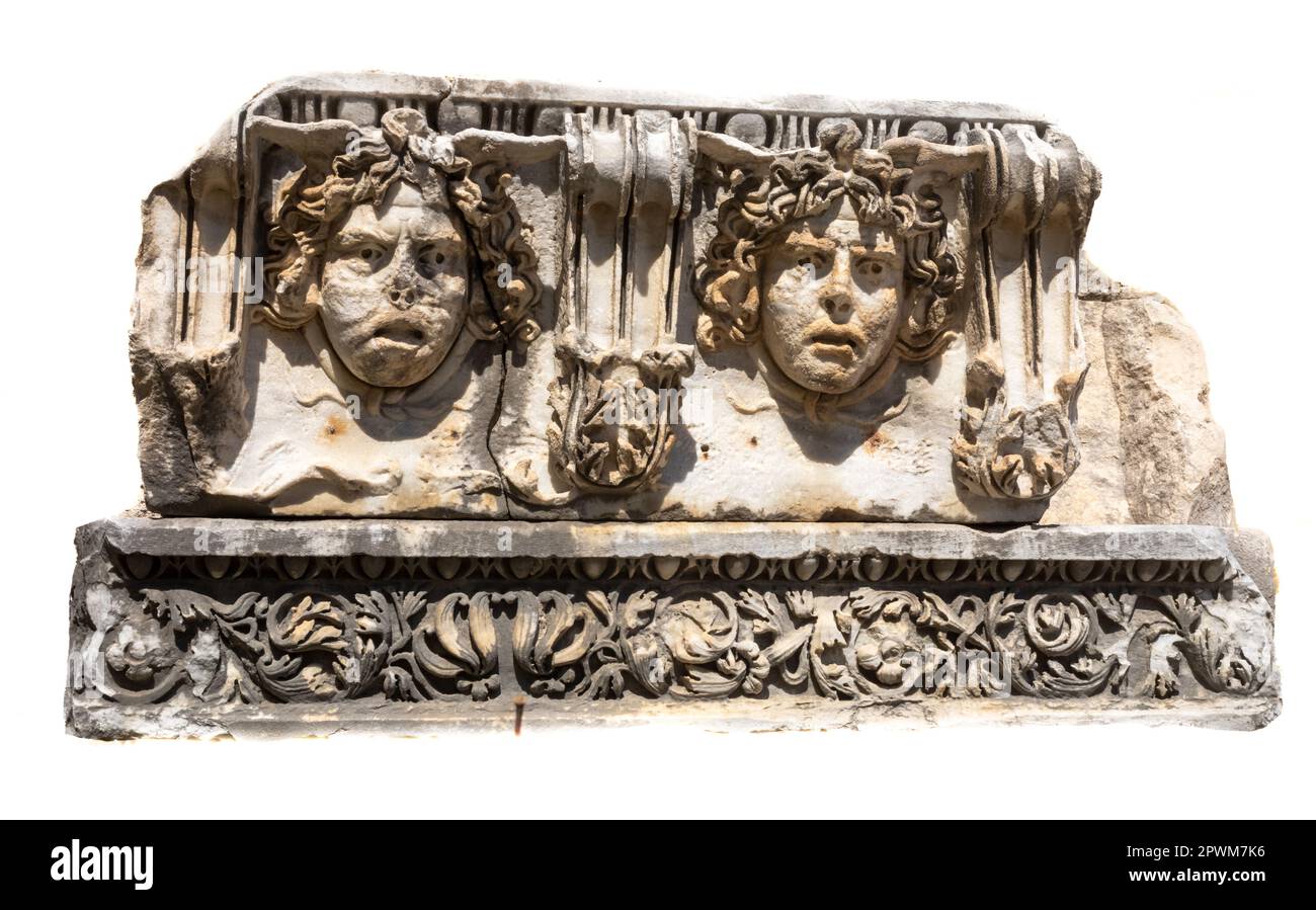 A section of intricately carved Roman-era stone frieze showing heads of Medusa dating from 2nd century AD on display in the Side Museum, Turkey. Medus Stock Photo
