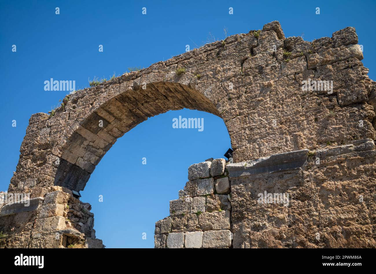 A view of the Monumental Gate in Side, in Antalya Province, Turkey (Turkiye). It was built during the reign of the Roman Emperor Vespasian in the 1st Stock Photo