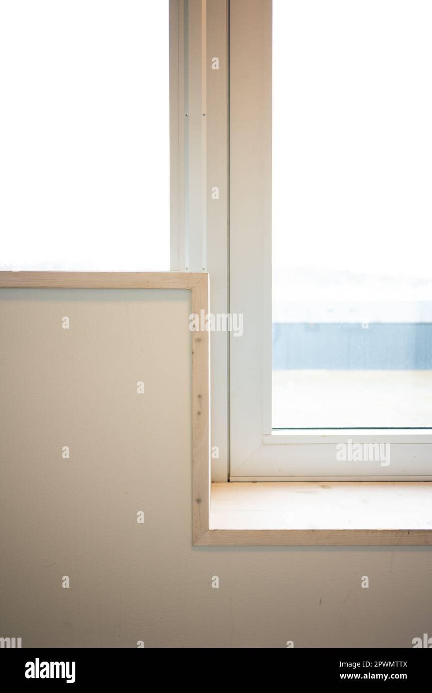 Window sill making a sharp angle by a door Stock Photo Alamy