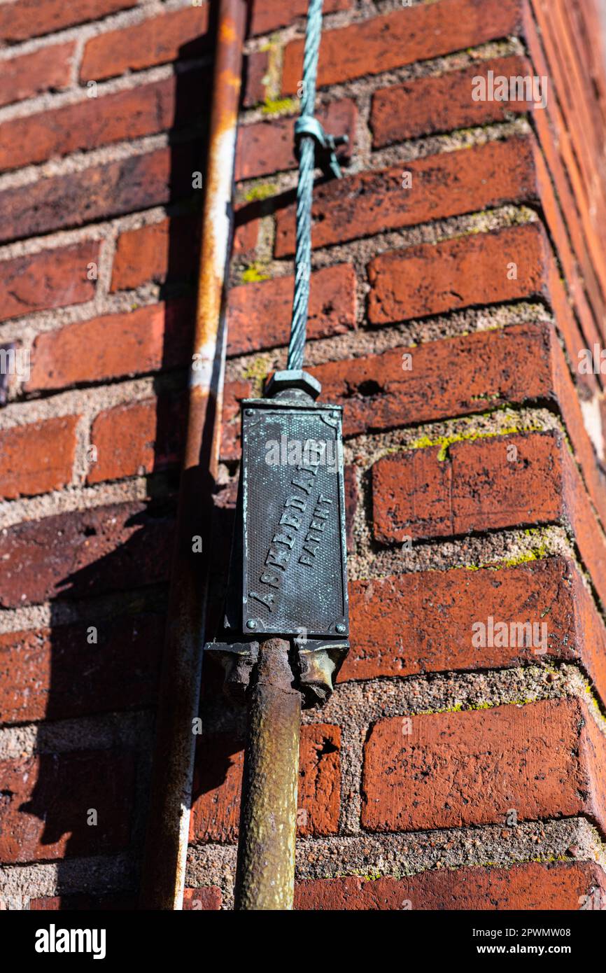 Lightning rod cable on the facade of a brick building Stock Photo Alamy