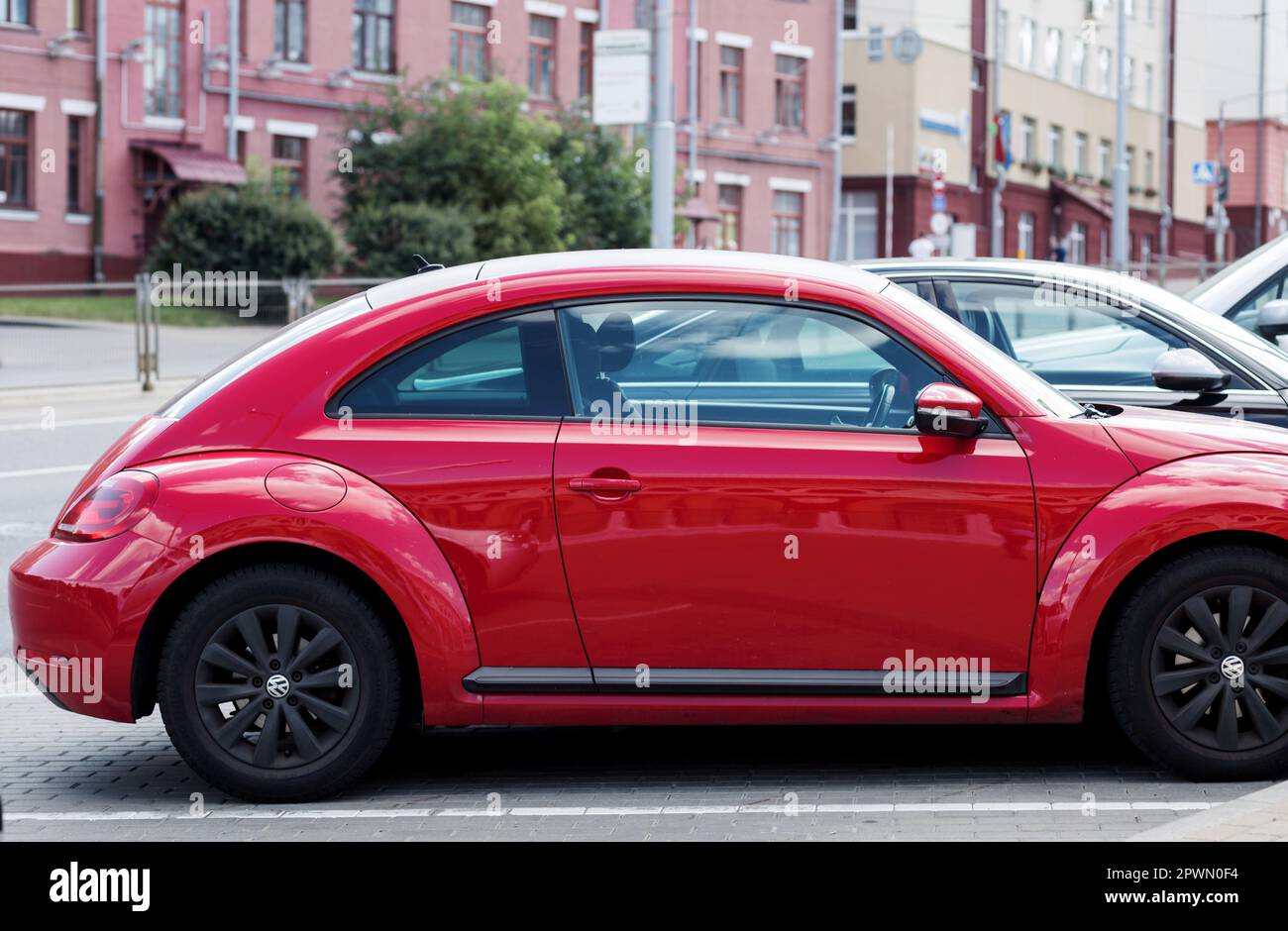 Minsk, Belarus, April 2023 - Red compact car Volkswagen Beetle on