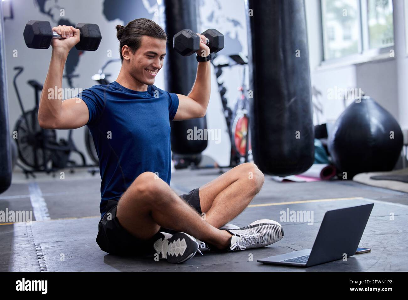 Man laptop and bodybuilder online class in gym for training workout fitness tutorial and happy for sports exercise. Athlete person dumbbell wellnes Stock Photo Alamy