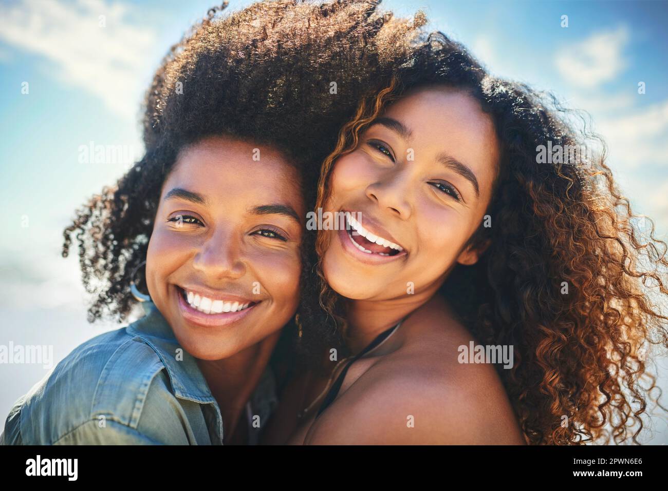 Im lucky to have a friend like you. two girlfriends enjoying themselves at the beach Stock Photo