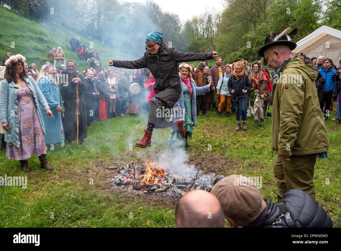 Glastonbury, UK. 1st May, 2023. Pagan Beltane Fire Ceremony and fire jumping in the Chalice Well Cress Field. Credit: Stephen Bell/Alamy Live News Stock Photo