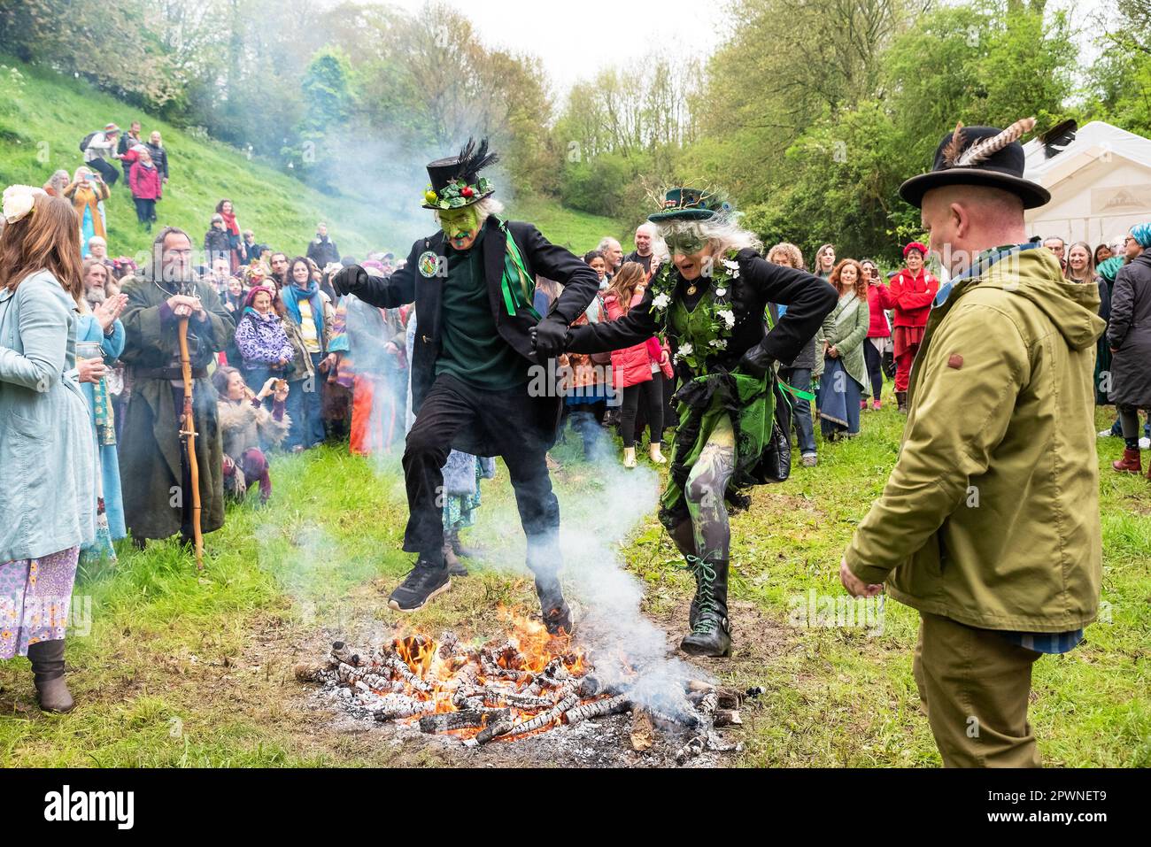Glastonbury, UK. 1st May, 2023. Pagan Beltane Fire Ceremony and fire jumping in the Chalice Well Cress Field. Credit: Stephen Bell/Alamy Live News Stock Photo