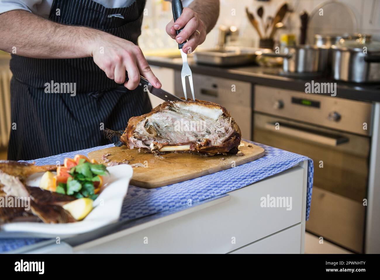 Chef carving a roasted duck Stock Photo