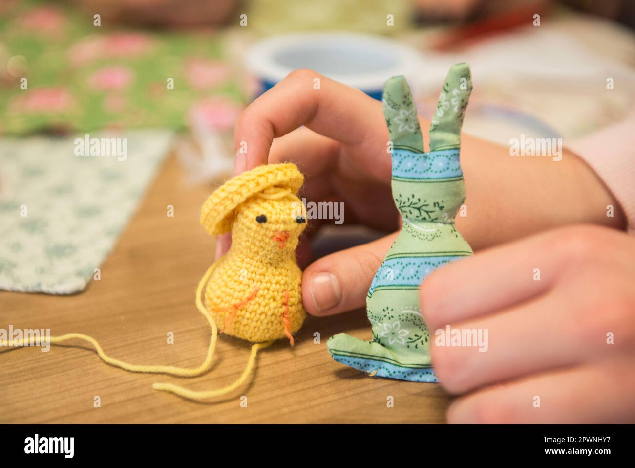 Girl holding handmade chick and rabbit Stock Photo