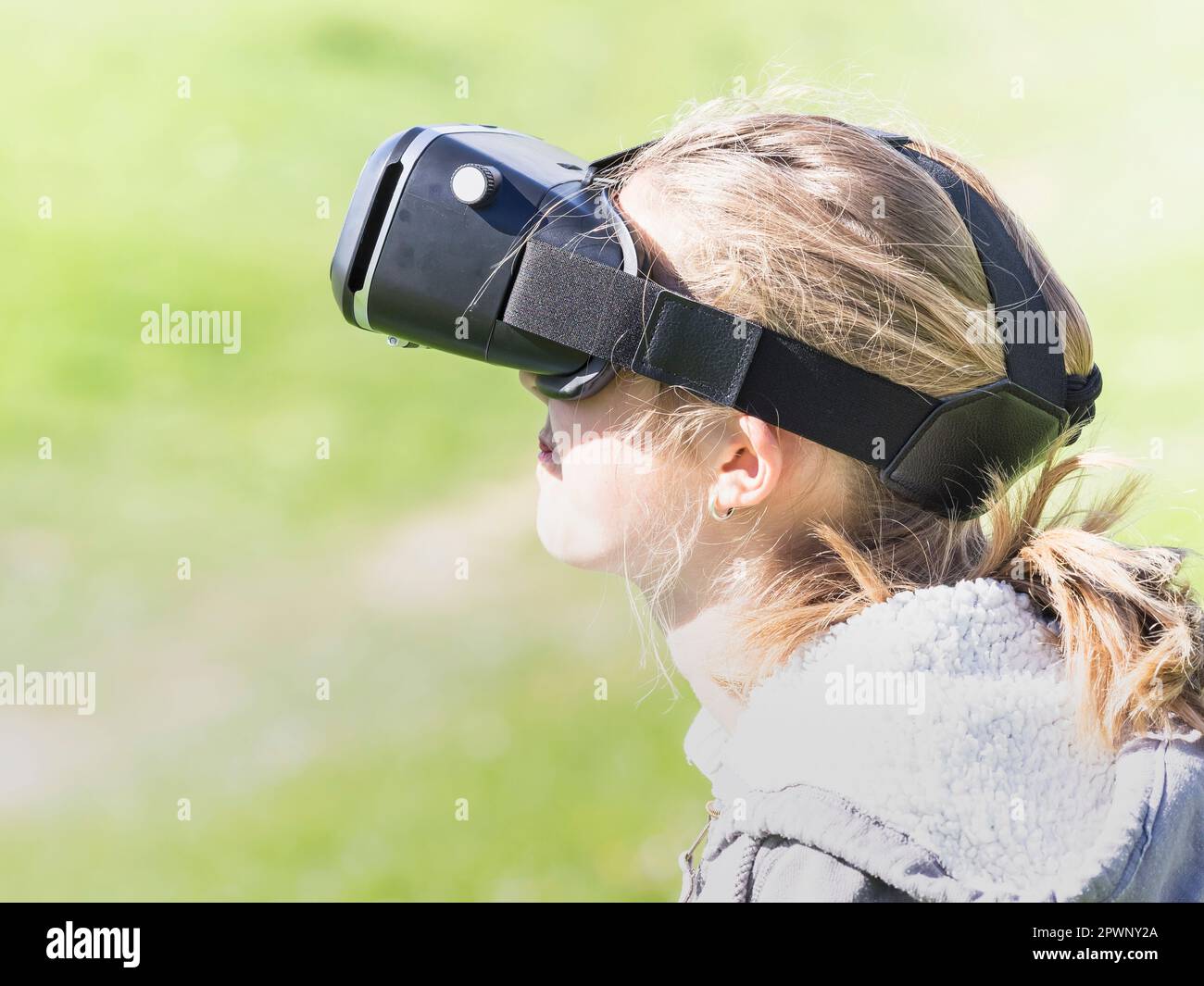 Girl using virtual reality headset Stock Photo