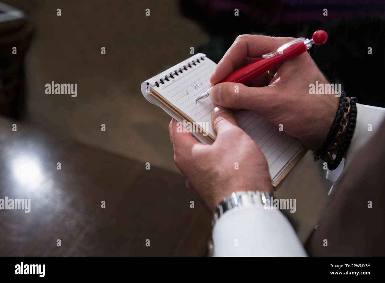 Cropped image of waiter writing order in note pad Stock Photo