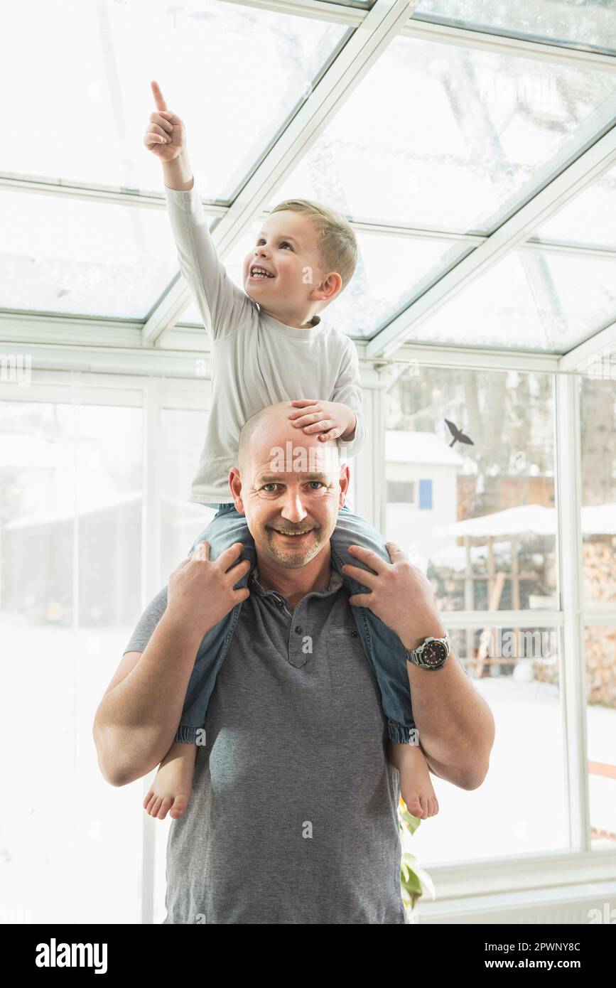 Smiling Father Standing completely bald childhood pointing smiling hi-res stock ...