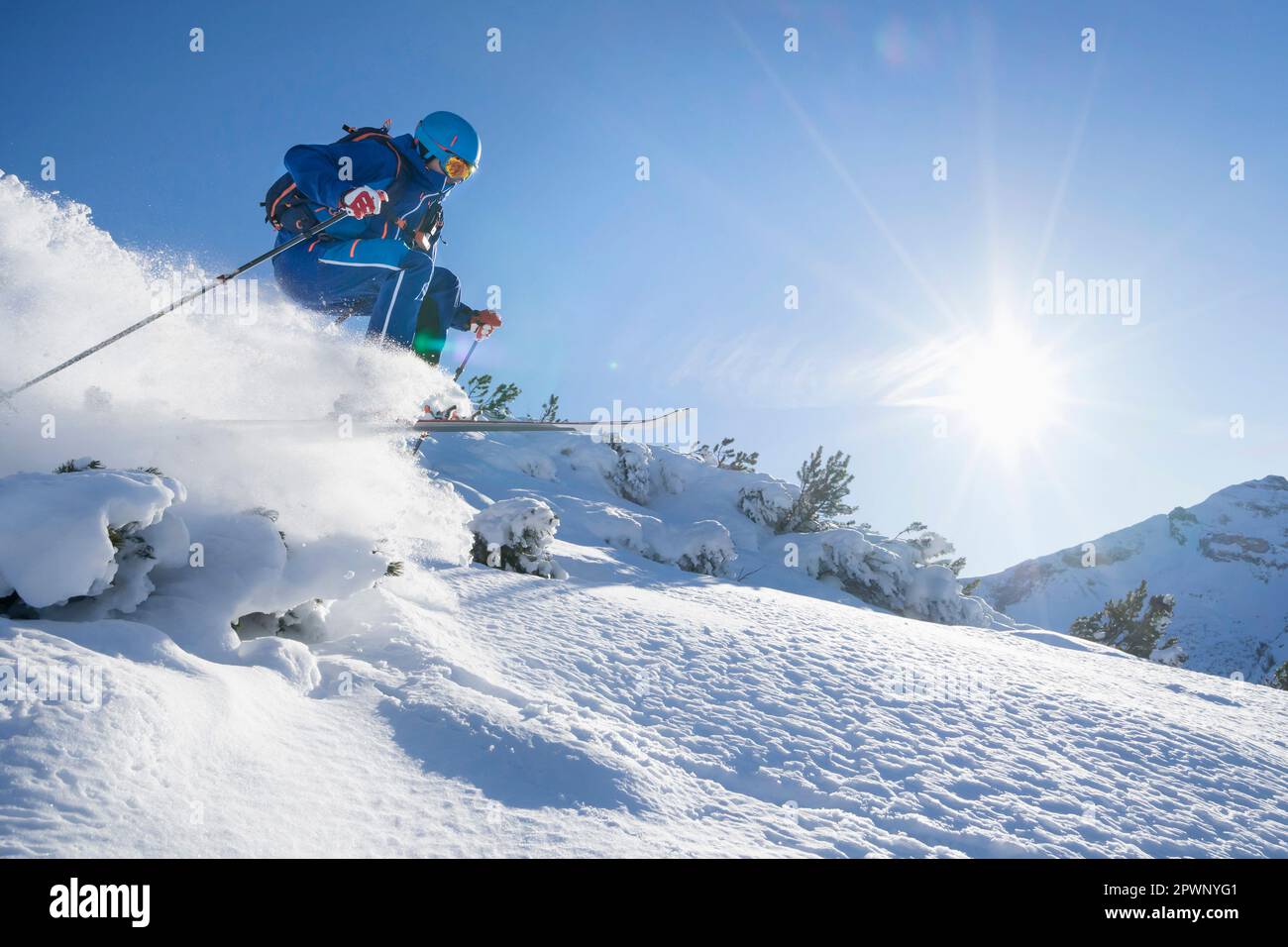 Skier jumping on snow Stock Photo