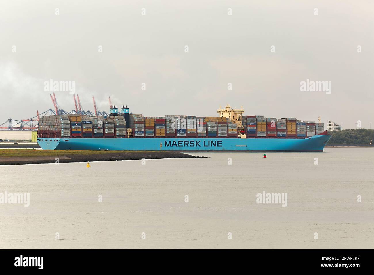 ROTTERDAM, THE NETHERLANDS - CIRCA 2017: Maersk Triple E class container ship leving the Port of Rotterdam. It's one of the largest container ships, 4 Stock Photo