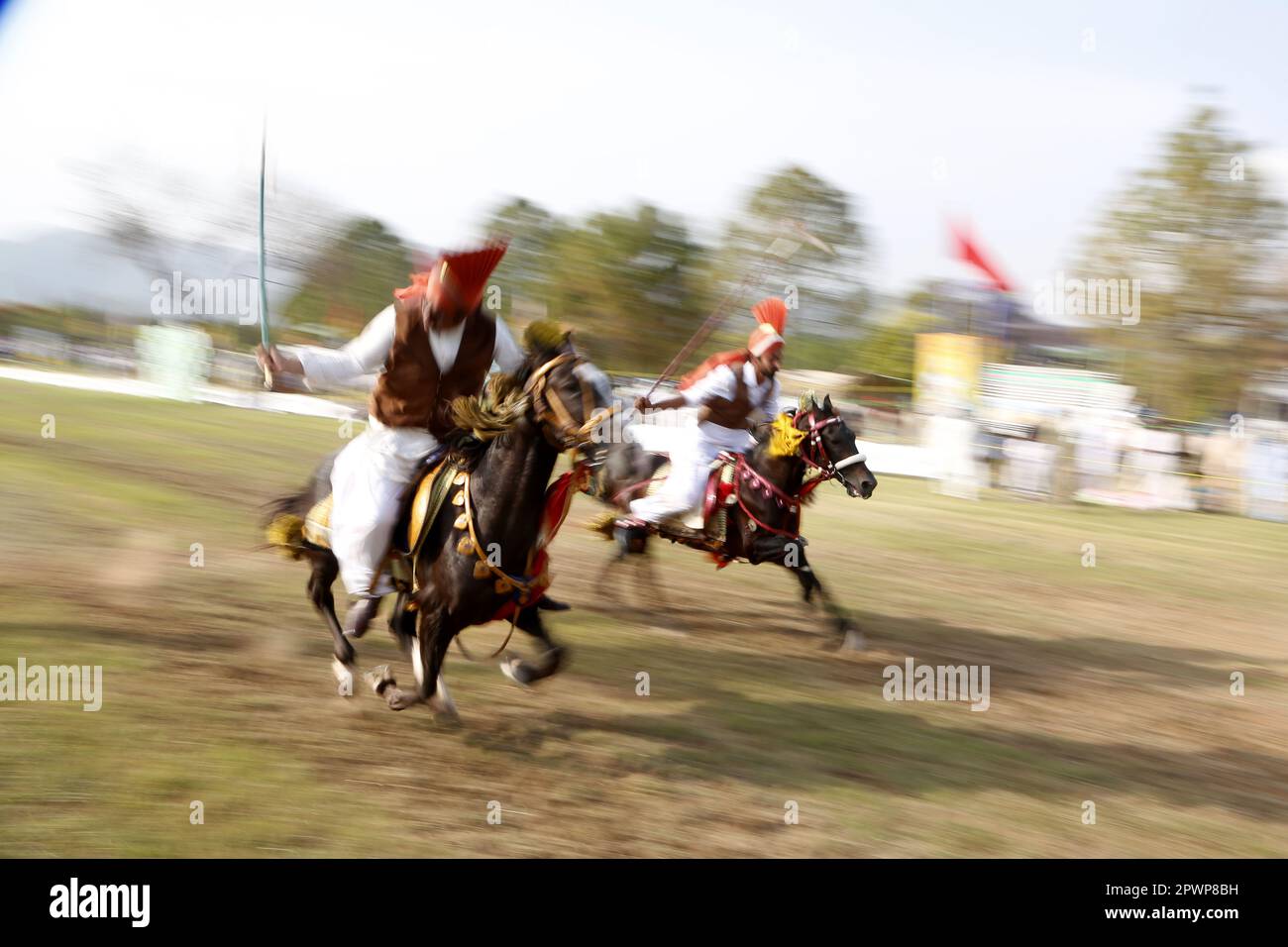 Islamabad. 30th Apr, 2023. Horse riders compete during a tent pegging ...