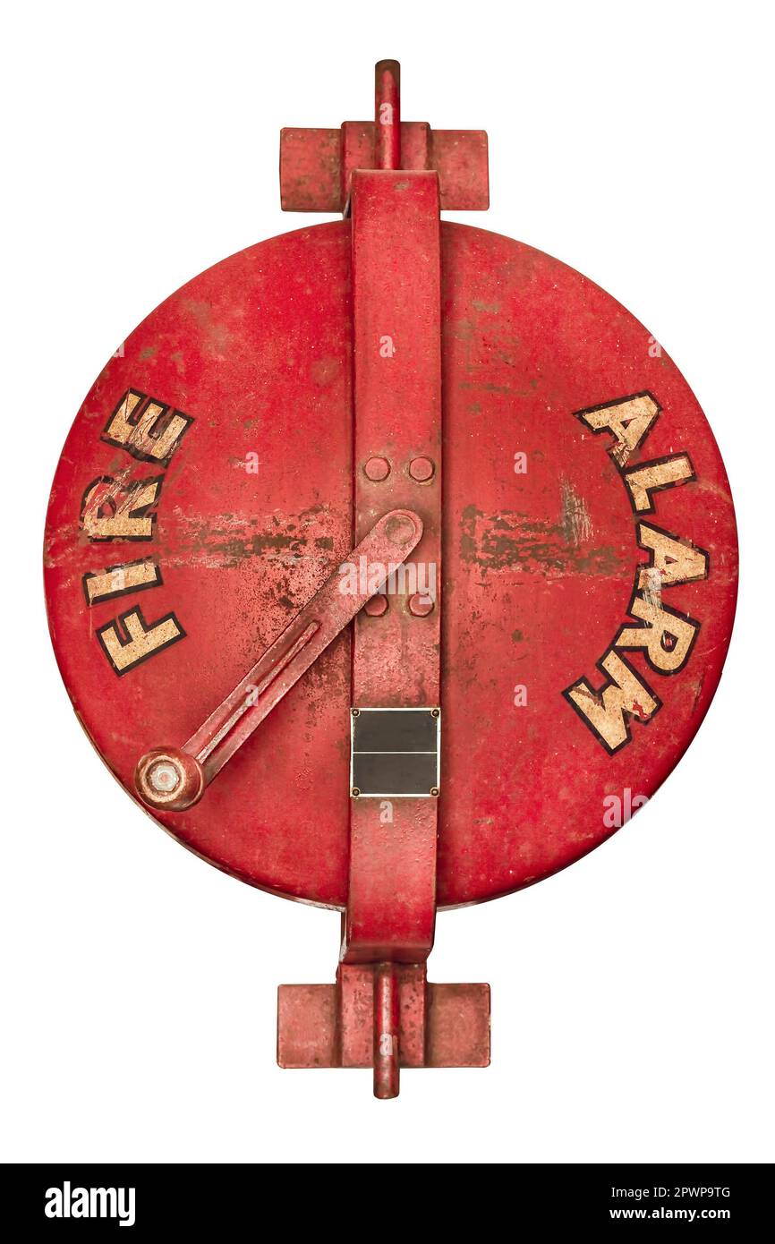 Old fire brigade manual fire alarm horn activated by spining the handle isolated on a white background Stock Photo