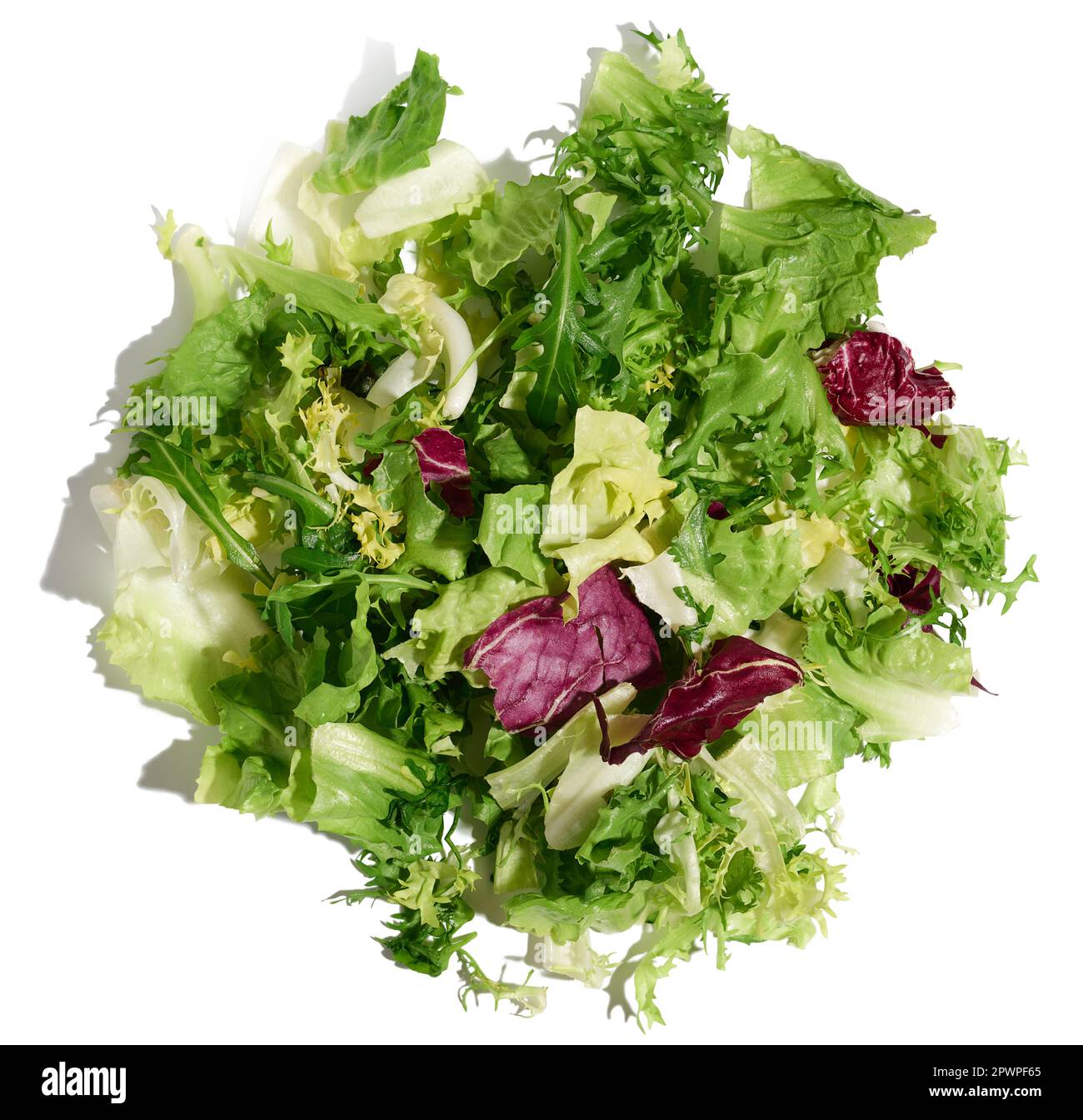 Mix of lettuce leaves escariole, frisee, radicchio, arugula on a white