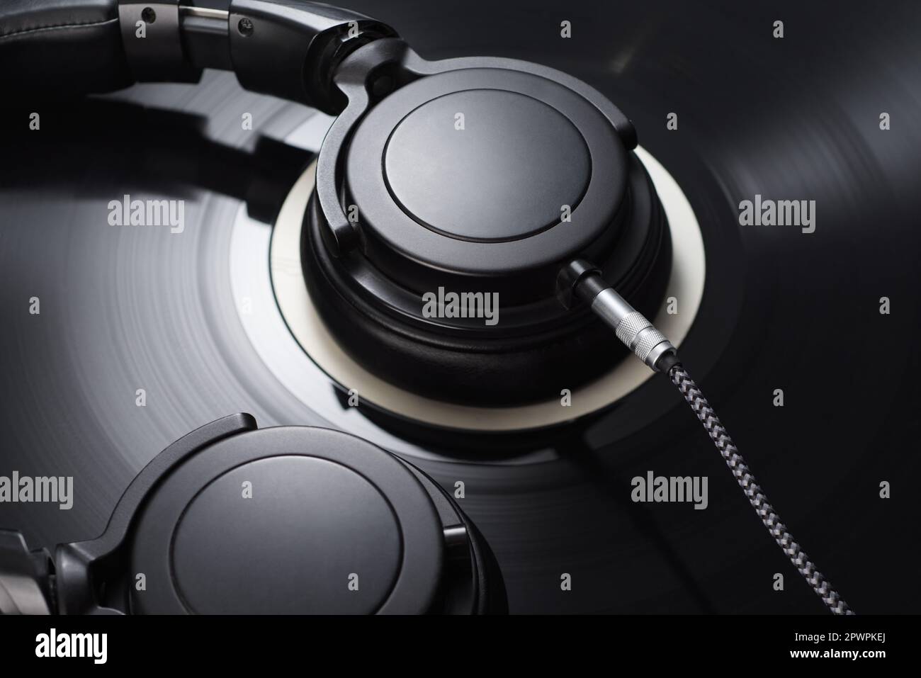 Vinyl Record With Black Headphones Close up Macro Shot Old fashioned vinyl-record-with-black-headphones-close-up-macro-shot-old-fashioned