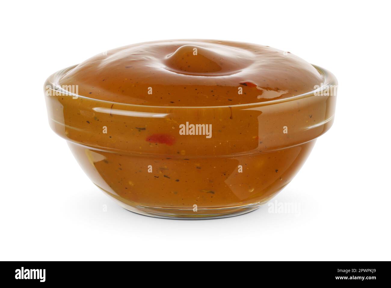 Apricot sweet and sour sauce for meat in the glass bowl isolated on