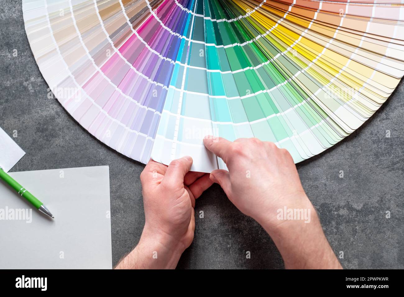 Designer or architect choosing samples the colors painting of the walls into room. interior design project. top view. Stock Photo