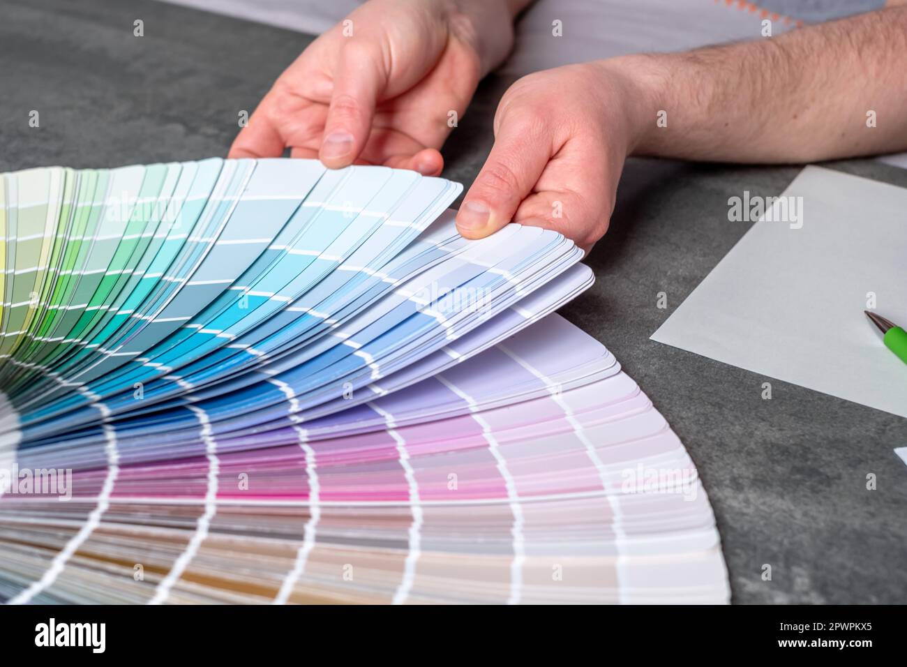 Designer or architect choosing samples the colors painting of the walls into room. Renovation of the house. Interior design inspiration Stock Photo