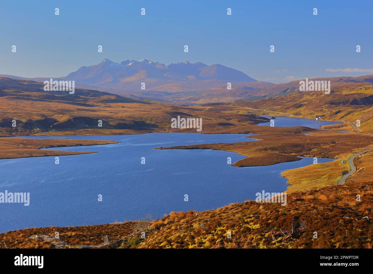 Morning light at Loch Leathan with the black cuilin mountains in the distance, isle of skye, scotland, uk. Stock Photo