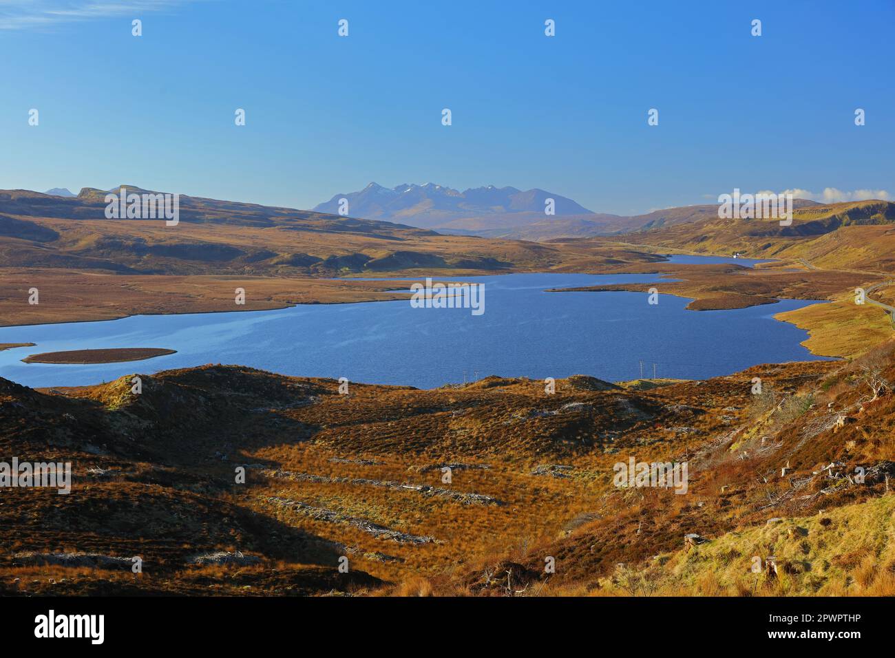 Morning light at Loch Leathan with the black cuilin mountains in the distance, isle of skye, scotland, uk. Stock Photo