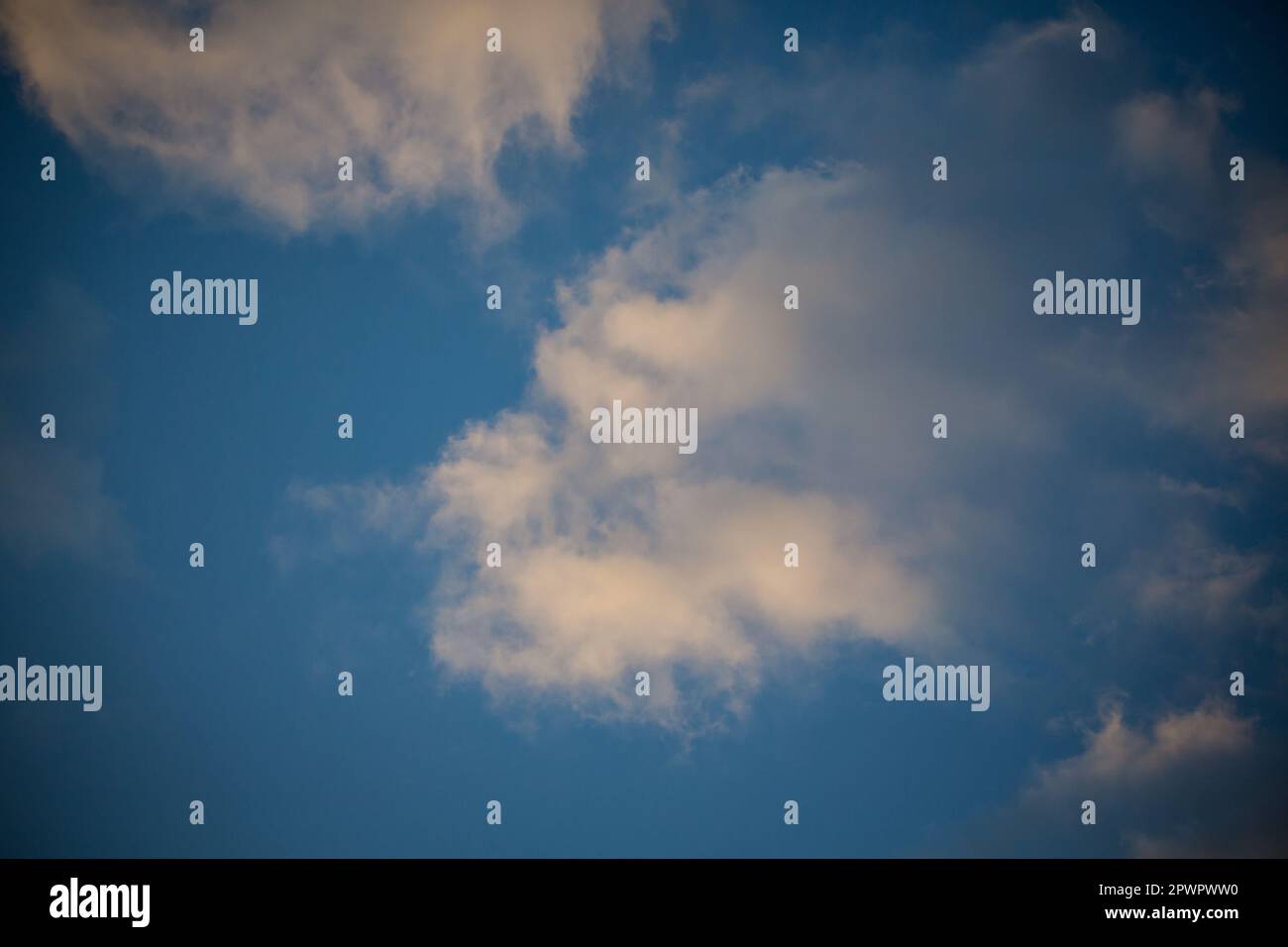 Cumulus clouds in the evening sky Stock Photo