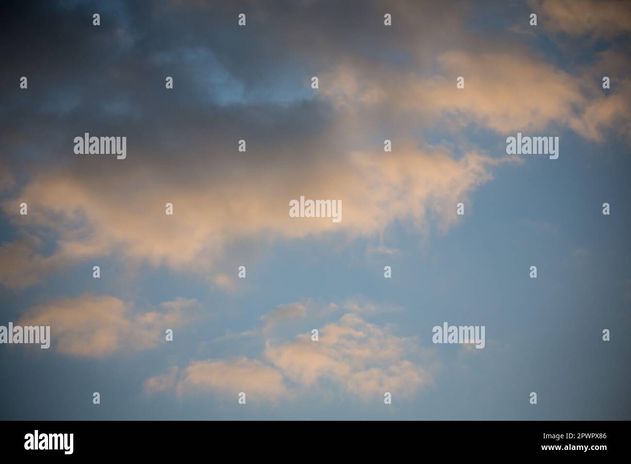 Cumulus clouds in the evening sky Stock Photo