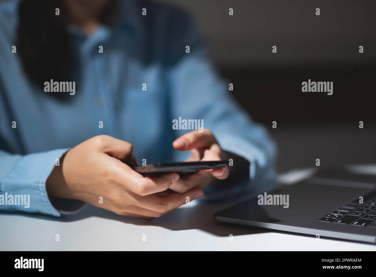 Close up of student hands using smart phone electronic learning. E-learning technology concept Stock Photo