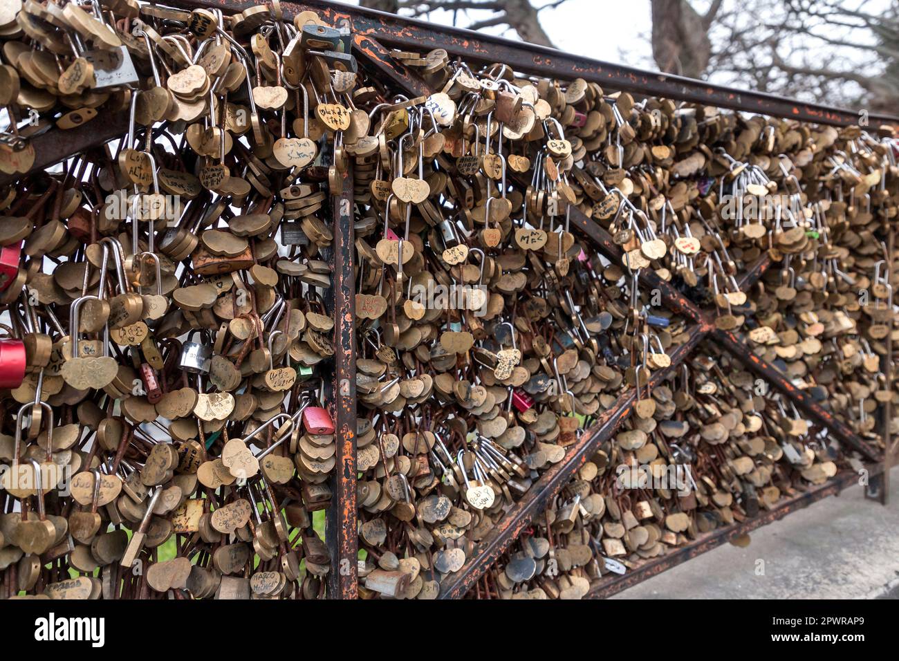 Paris, France January 19, 2022 Lots of padlocks on a grid mesh fence