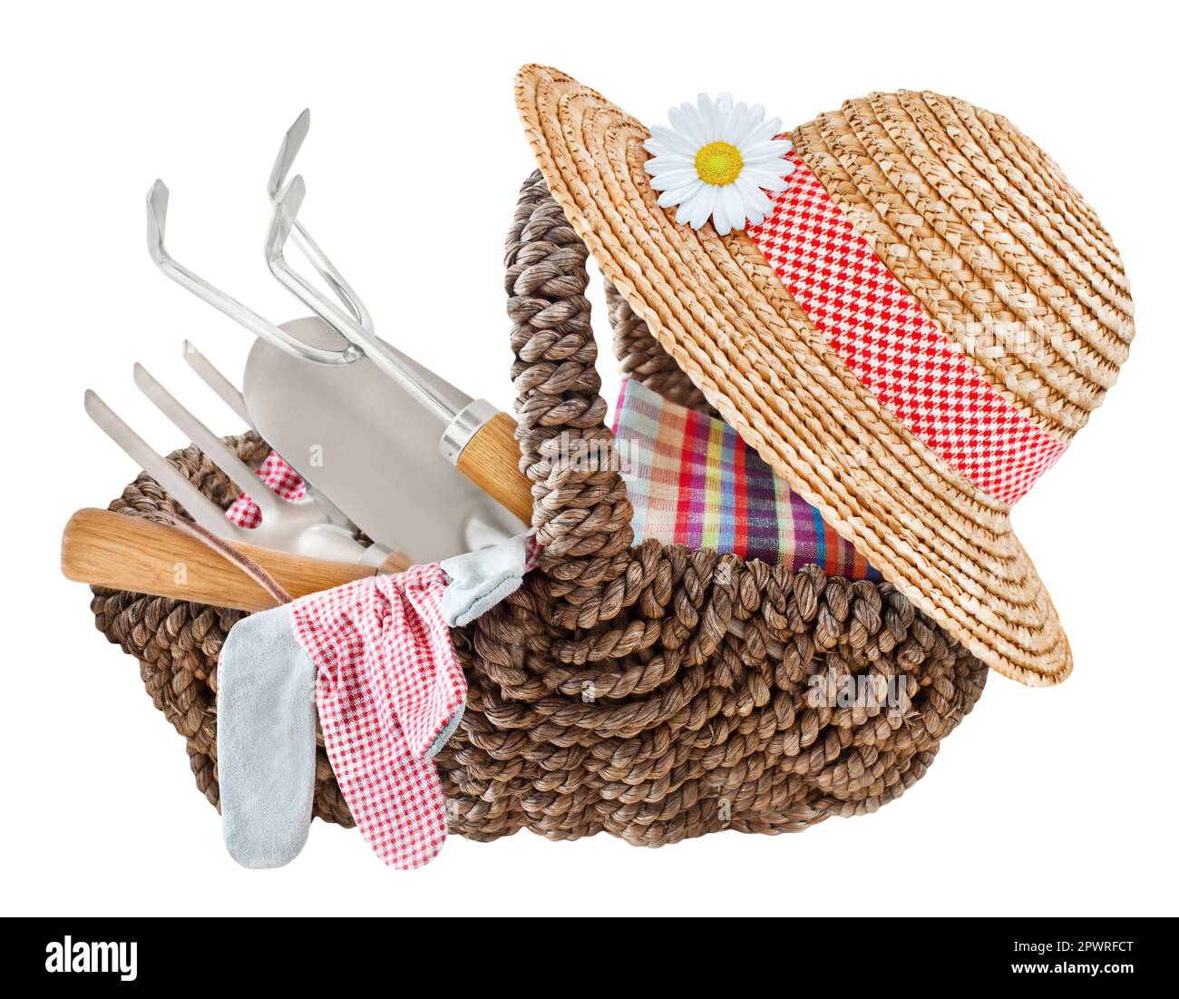 Garden tools and straw hat in a basket isolated on white background Stock Photo