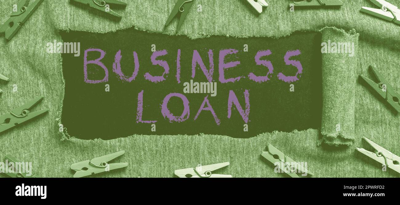 Hand writing sign Business Loan, Business approach Credit Mortgage Financial Assistance Cash Advances Debt Stock Photo