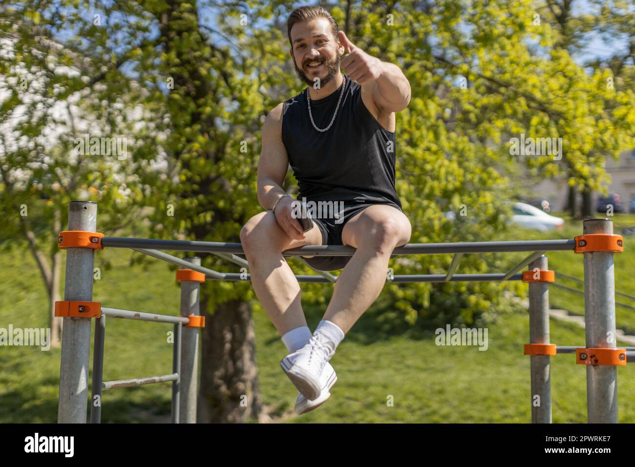 Athletic man in sportswear raises thumbs up gives positive feedback ... - Haptic Feedback Athletic Wear For Strength Training