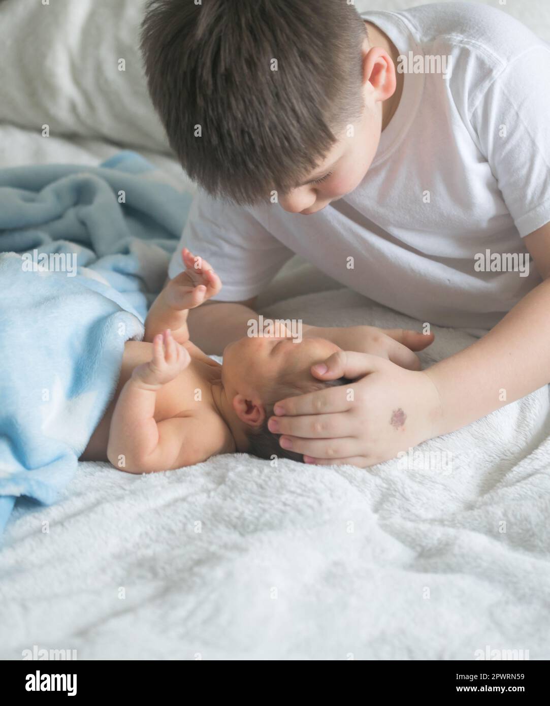 Big brother with his little newborn brother. love family concept Stock Photo