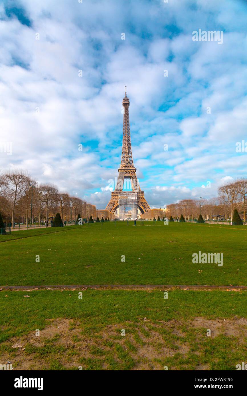 The iconic Eiffel Tower in a sunny winter day, wrought-iron lattice tower on the Champ de Mars in Paris, France. Stock Photo